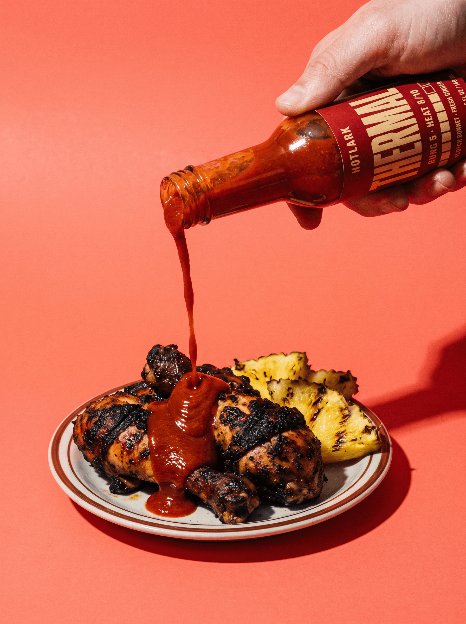 Thermal poured over jerk chicken and grilled pineapple